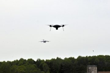 a photo of two drones flying in the sky